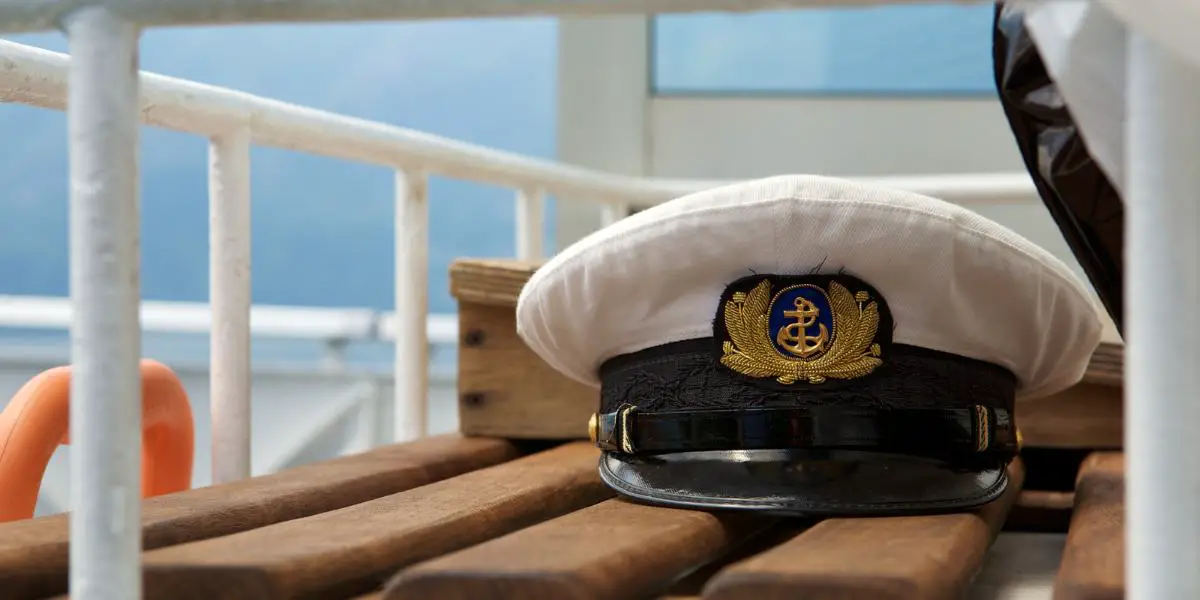 cruise captain cap on deck