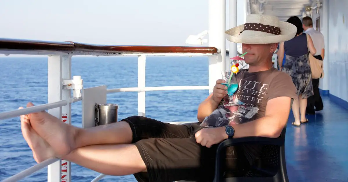 Single man relaxing with cocktail on cruise