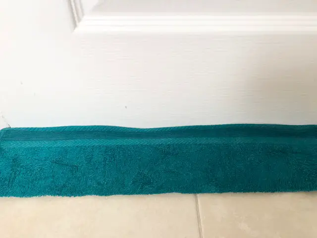 Damp towel at base of cabin door